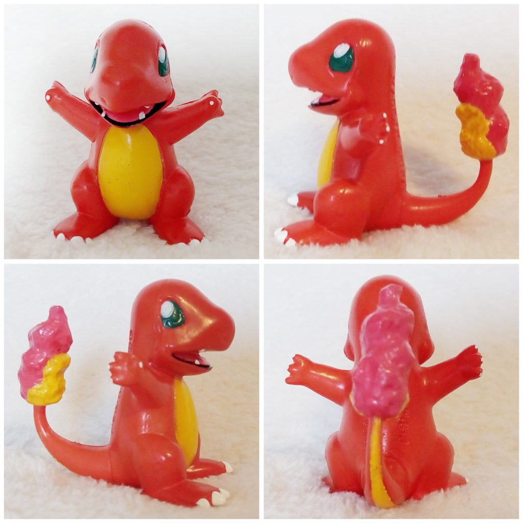 A front, left, right and back view of the Pokémon Tomy figure Charmander