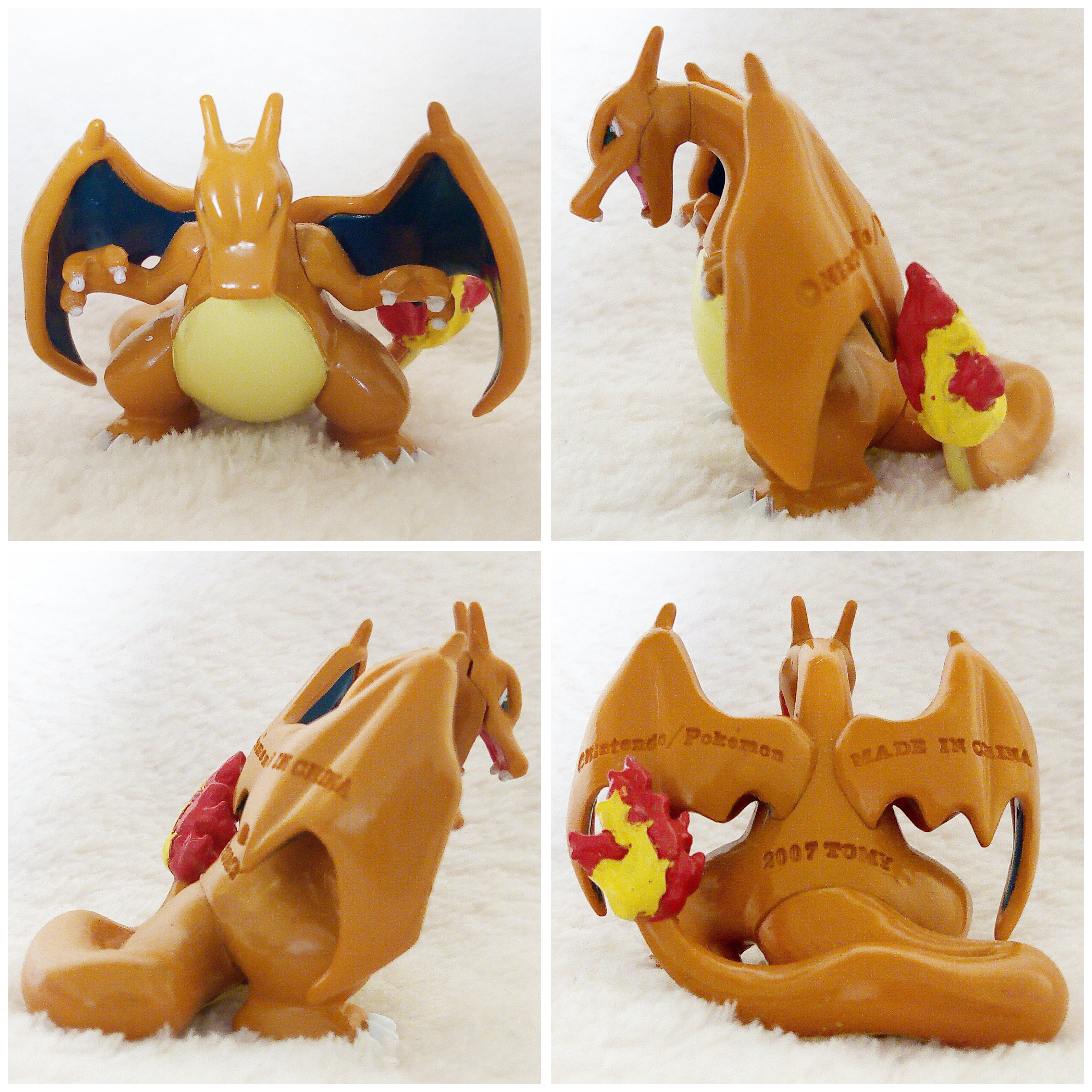A front, left, right and back view of the Pokémon Tomy figure Charizard alternative