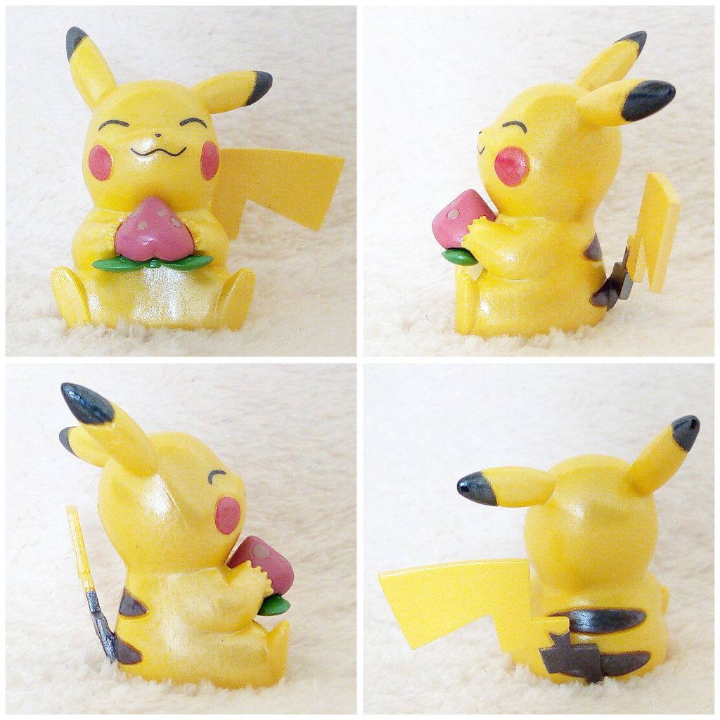 A front, left, right and back view of the Pokémon Tomy figure Pikachu with Pecha Berry (pearly)