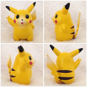 A front, left, right and back view of the Pokémon Tomy figure Pikachu Victory pose
