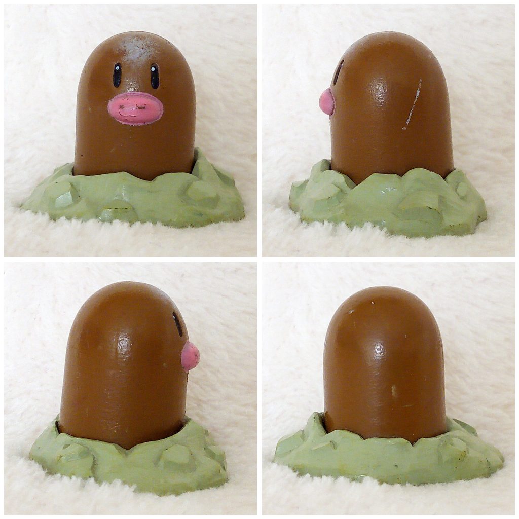 A front, left, right and back view of the Pokémon Tomy figure Diglett
