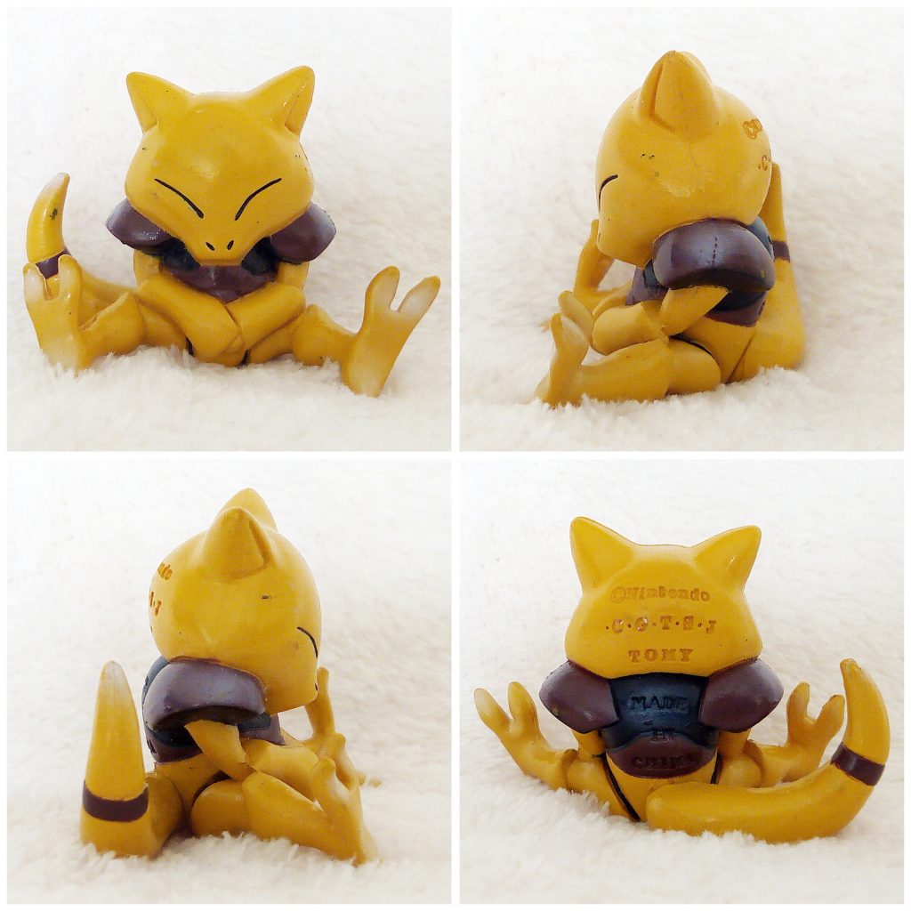 A front, left, right and back view of the Pokémon Tomy figure Abra