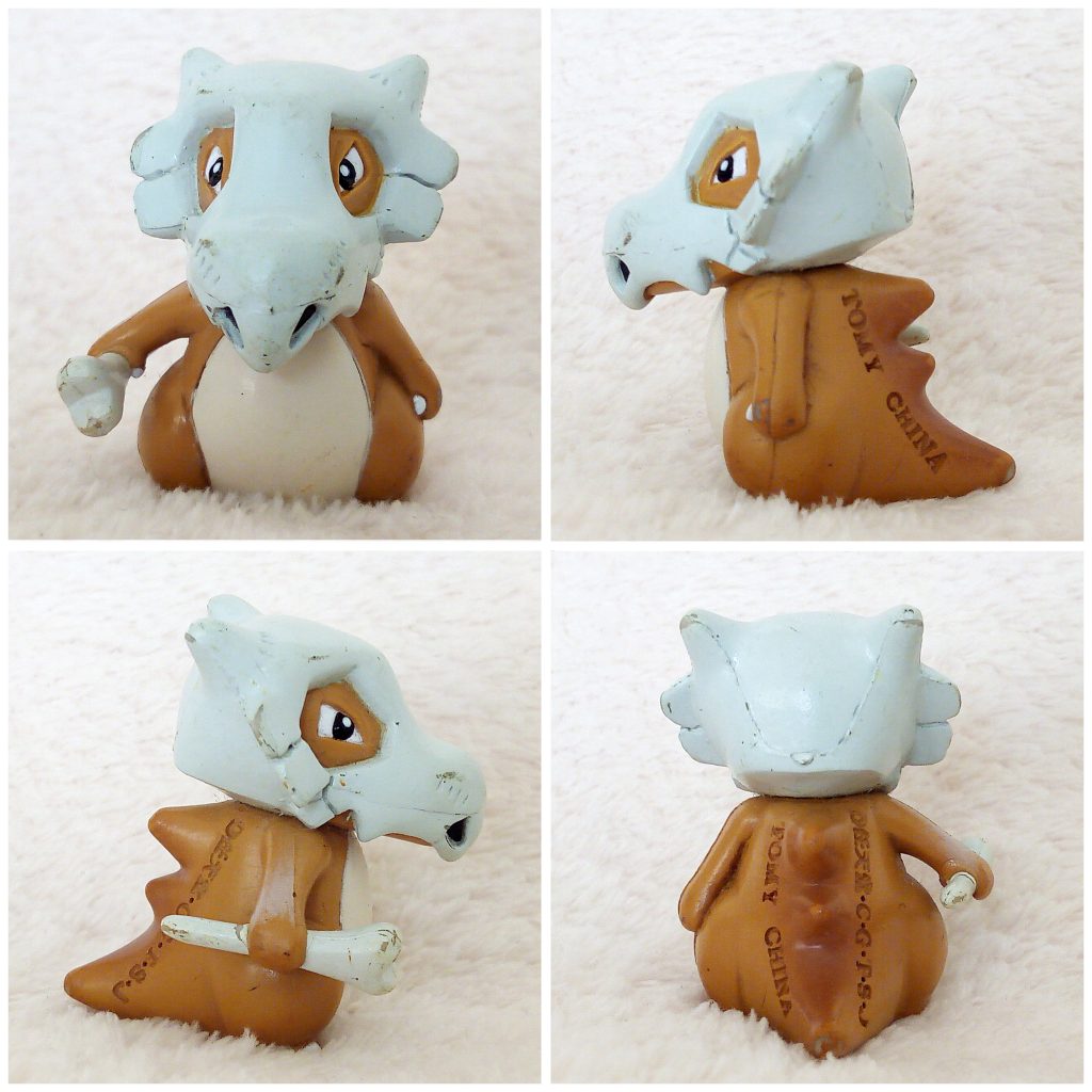 A front, left, right and back view of the Pokémon Tomy figure Cubone