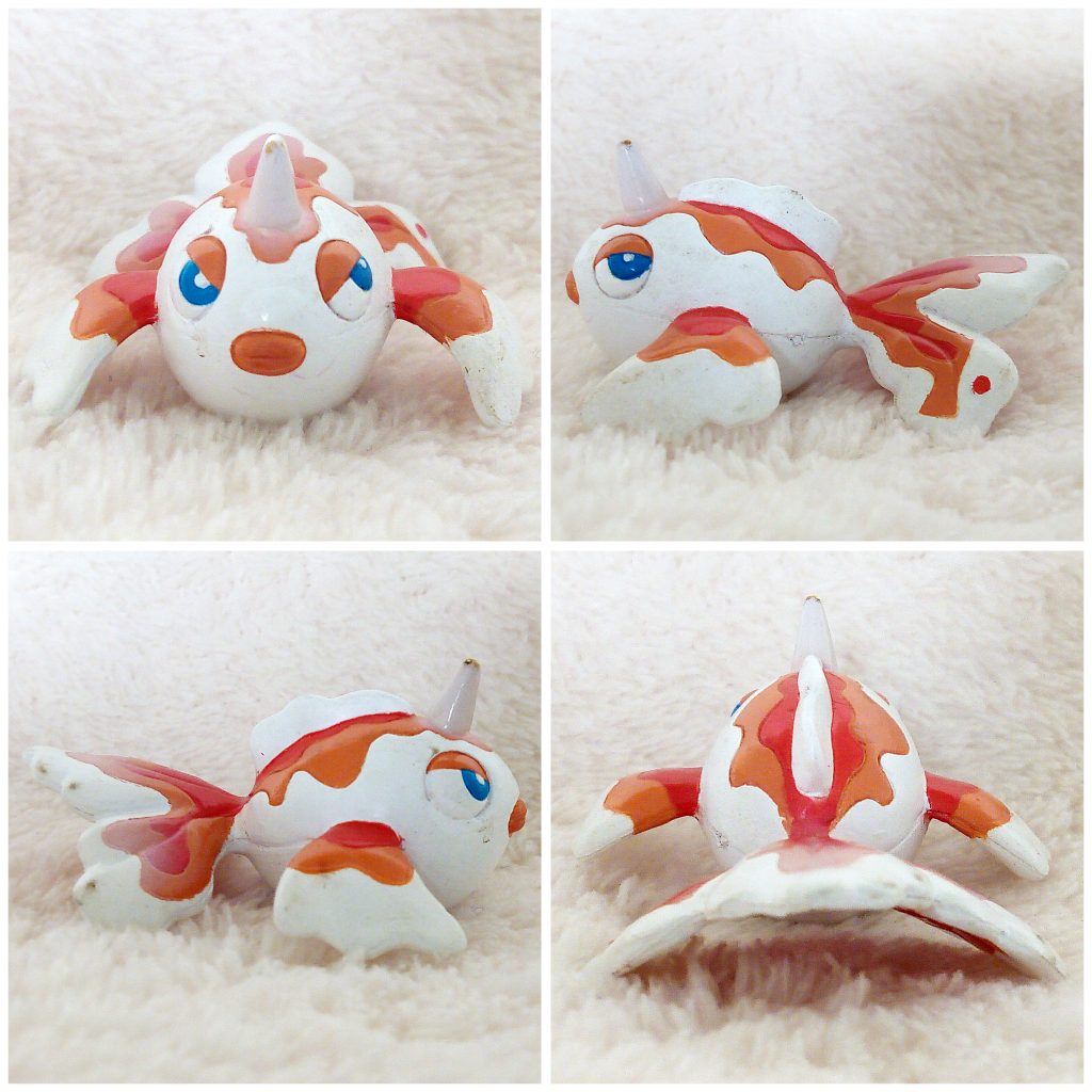 A front, left, right and back view of the Pokémon Tomy figure Goldeen