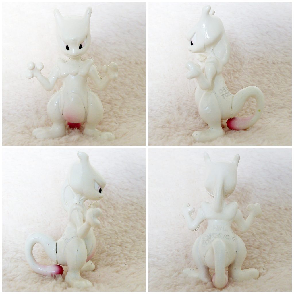 A front, left, right and back view of the Pokémon Tomy figure Mewtwo