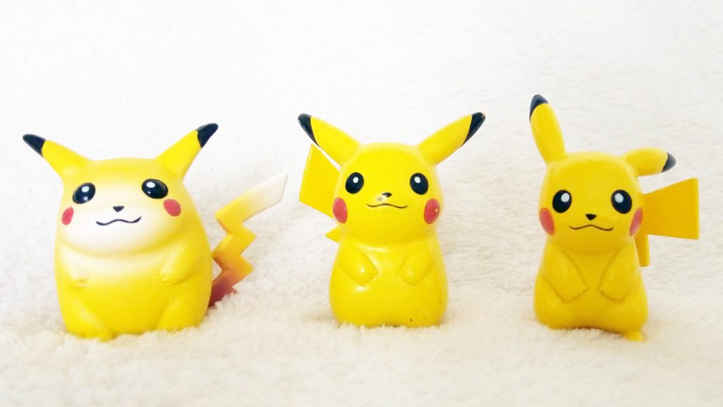 3 Pokémon Tomy Figures of Pikachu for  comparison