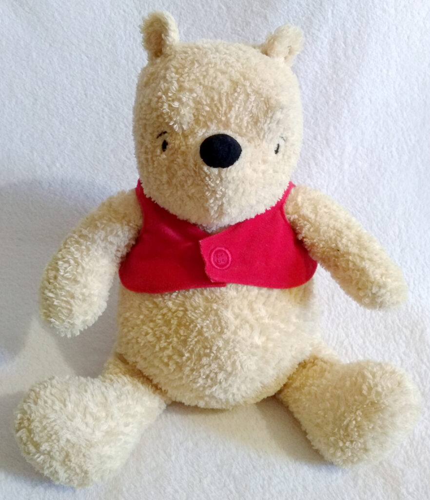 A front view of Winnie the Pooh, Classic Pooh plush by Golden Bear