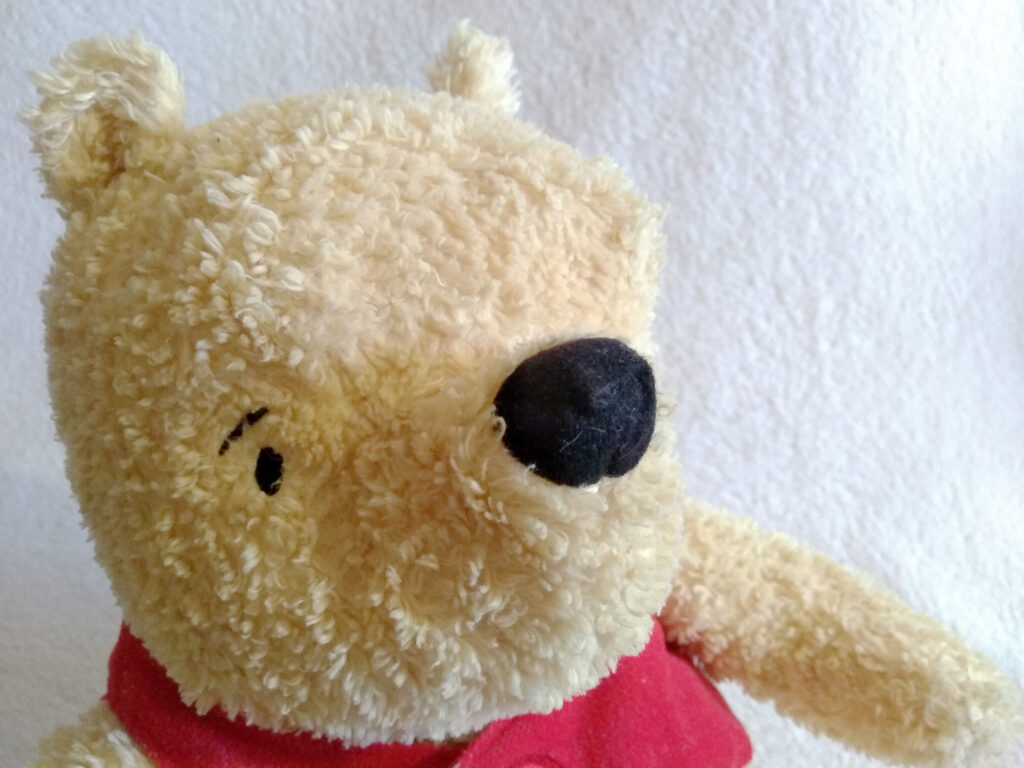 A headshot of Winnie the Pooh, Classic Pooh plush by Golden Bear