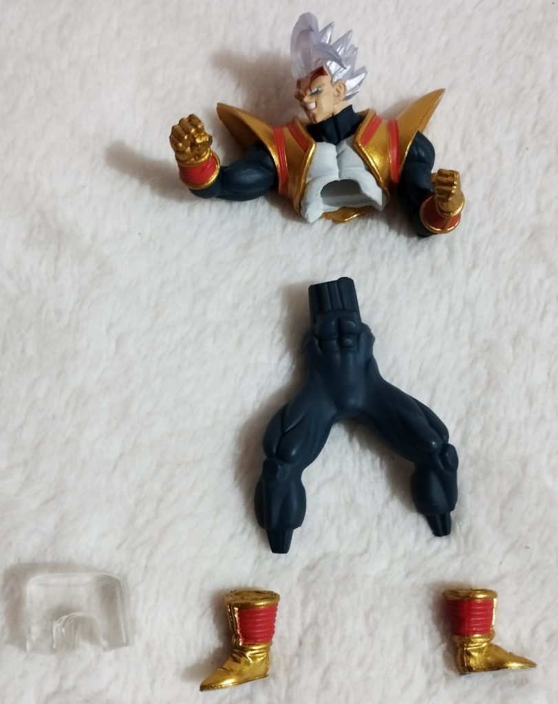 Gashapon figure laid out in pieces