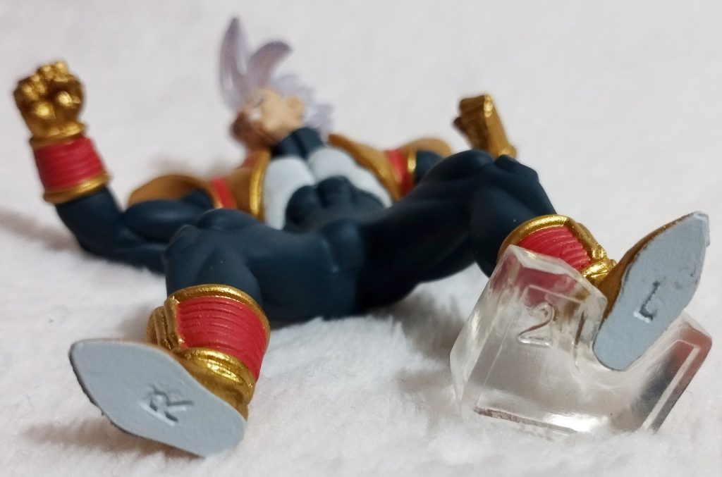 Gashapon figure with L and R on its Left and Right foot respectively
