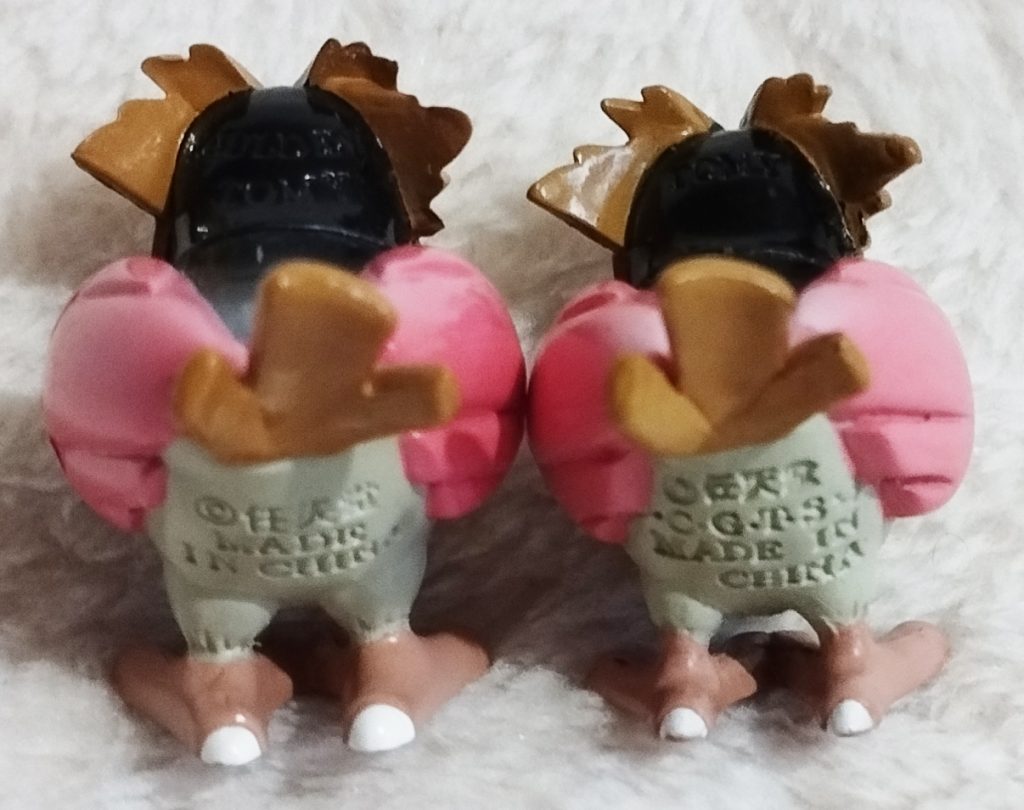 A back view of the Pokémon Tomy figures Spearow; left Auldey variant, right Hasbro variant 